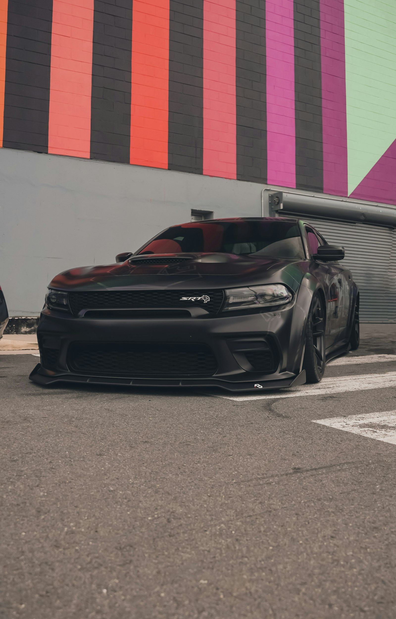 Black Dodge Charger with dark tinted windows