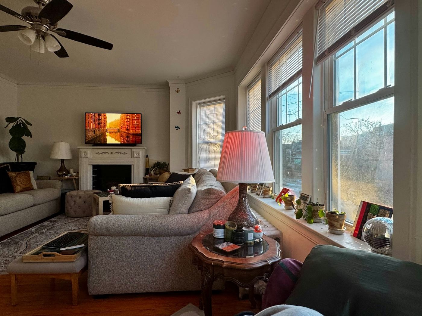 Bright living room with a wall of tall windows in afternoon light
