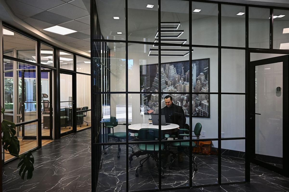 Office with black-framed glass partitions